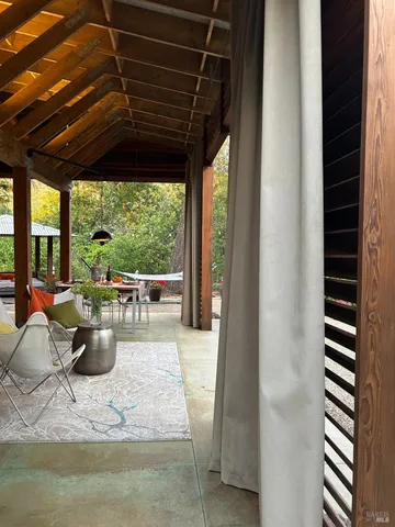 a wooden bench sitting in front of building