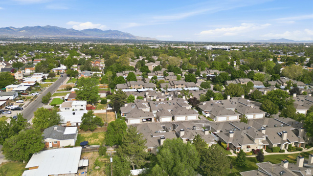 6969 South 855 East Midvale, UT 84047 - Photo 39 of 55 Expansive residential community with established landscaping and mountain backdrop