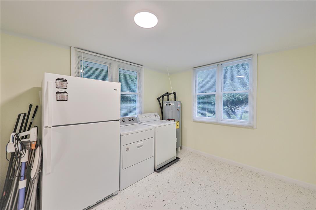 5599 Minks Pond Road Bushkill, PA 18324 - Photo 18 of 64 Functional utility room with ample natural illumination, housing essential laundry appliances.