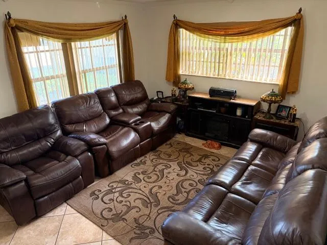 a kitchen with granite countertop wooden cabinets and stainless steel appliances