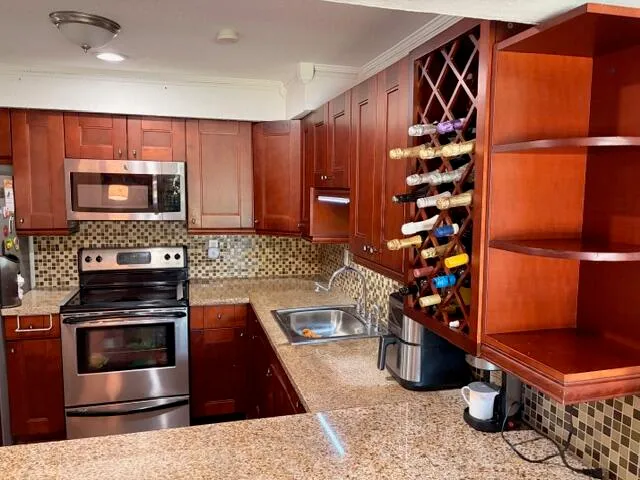 a view of a livingroom with an empty space and a window