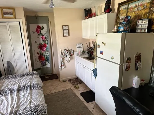 a bedroom with cabinets and bed