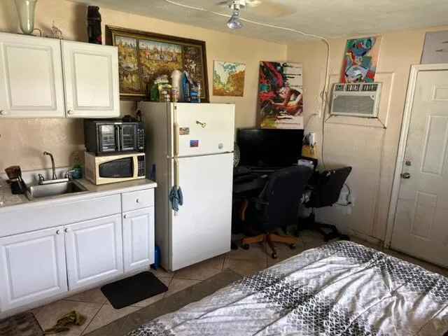 a view of a chairs and table in patio