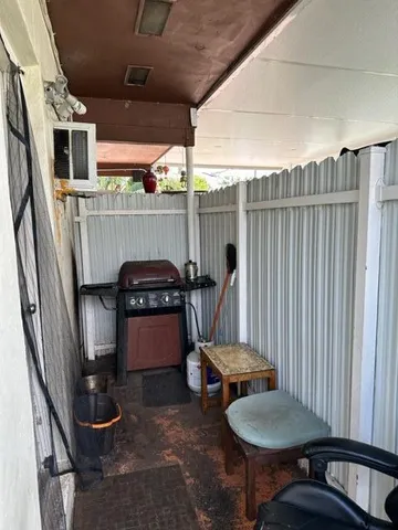 a outdoor dining space with furniture and outdoor view