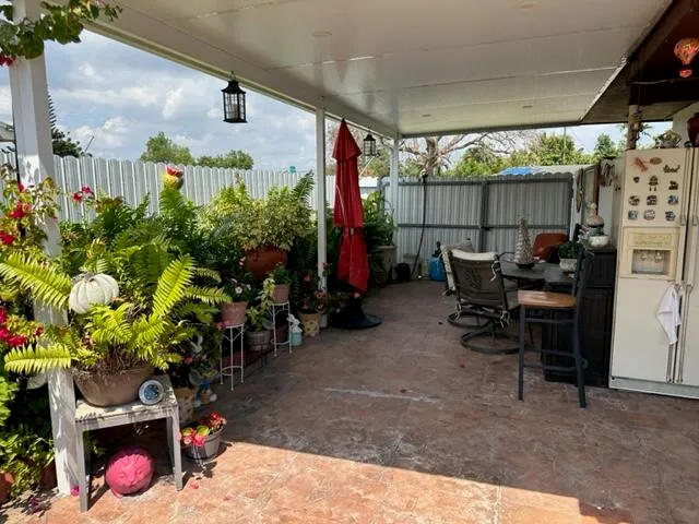 a view of a table and chairs in the garden