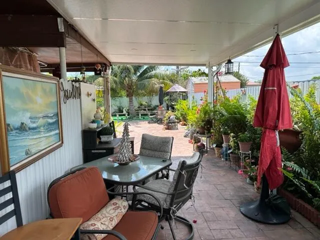 a view of a table and chairs in the garden