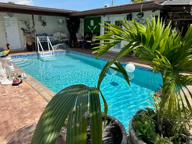a view of a back yard of the house