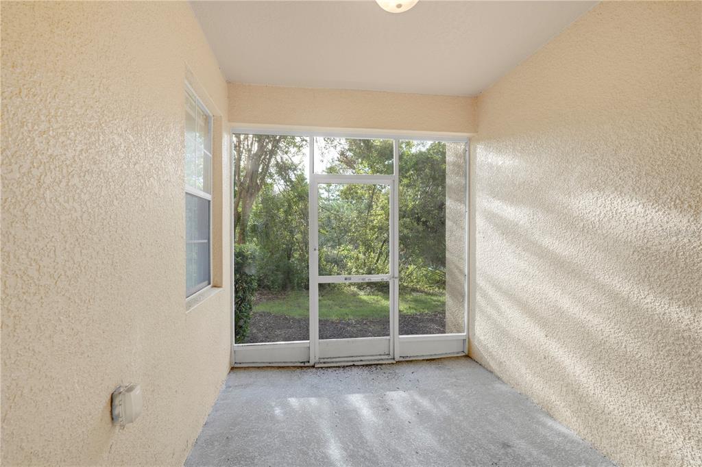 839 Assembly Court Reunion, FL 34747 - Photo 12 of 31 a view of room with window and floor to ceiling window