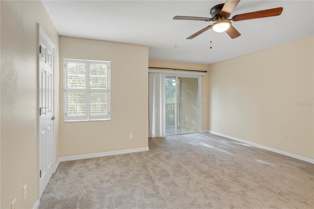 839 Assembly Court Reunion, FL 34747 - Photo 13 of 31 wooden floor in an empty room with a window