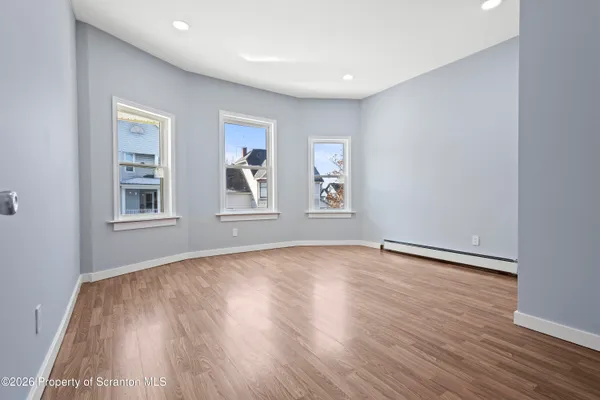 an empty room with windows