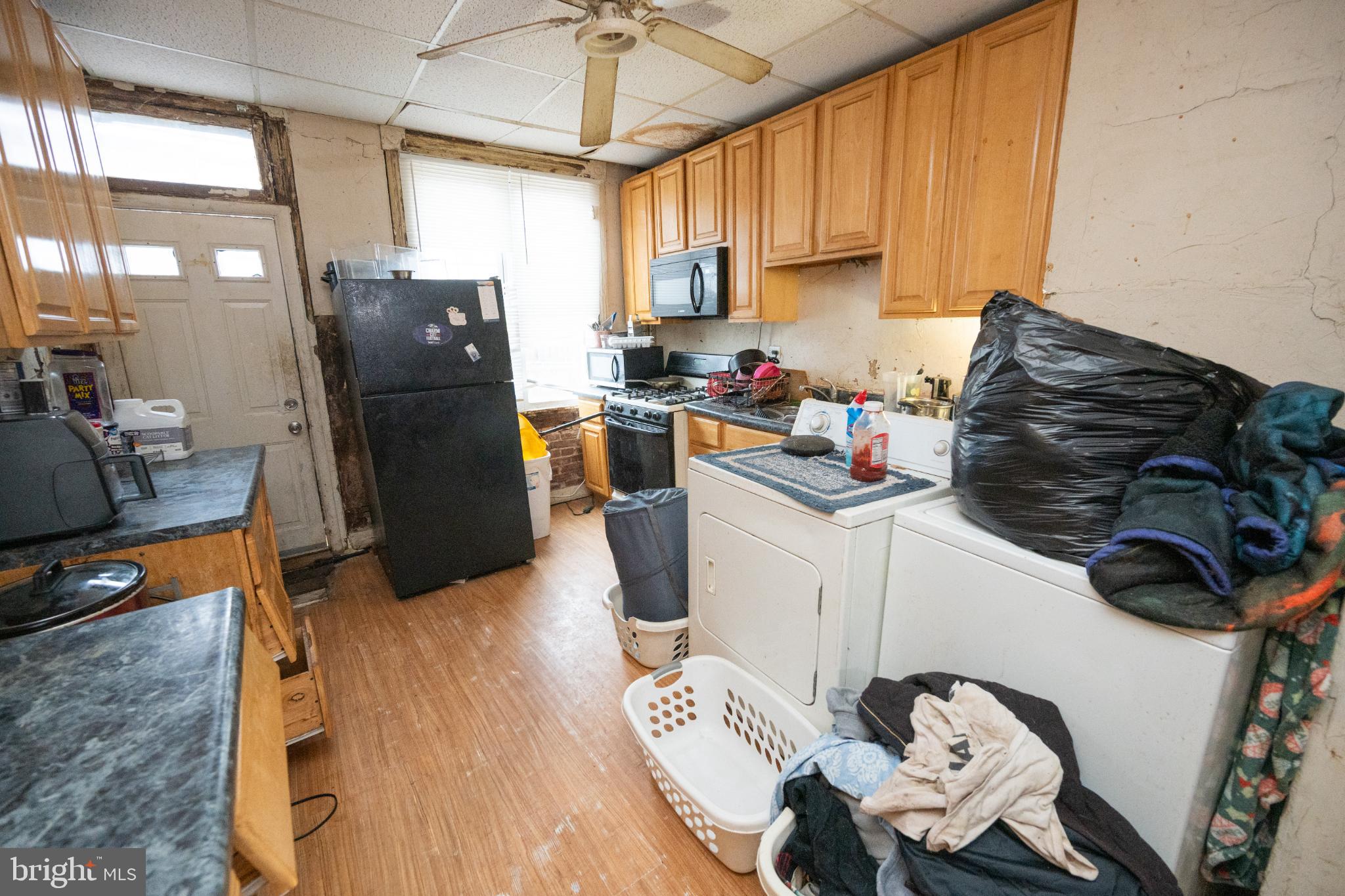 1208 Sargeant Street Baltimore, MD 21223 - Photo 5 of 25 Functional kitchen with laundry area.