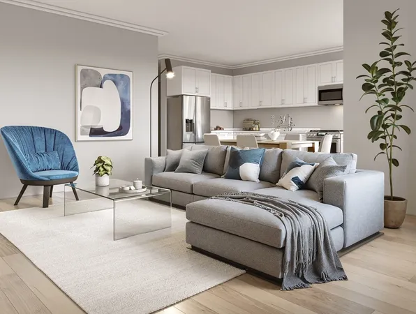 a living room with a couch and a potted plant