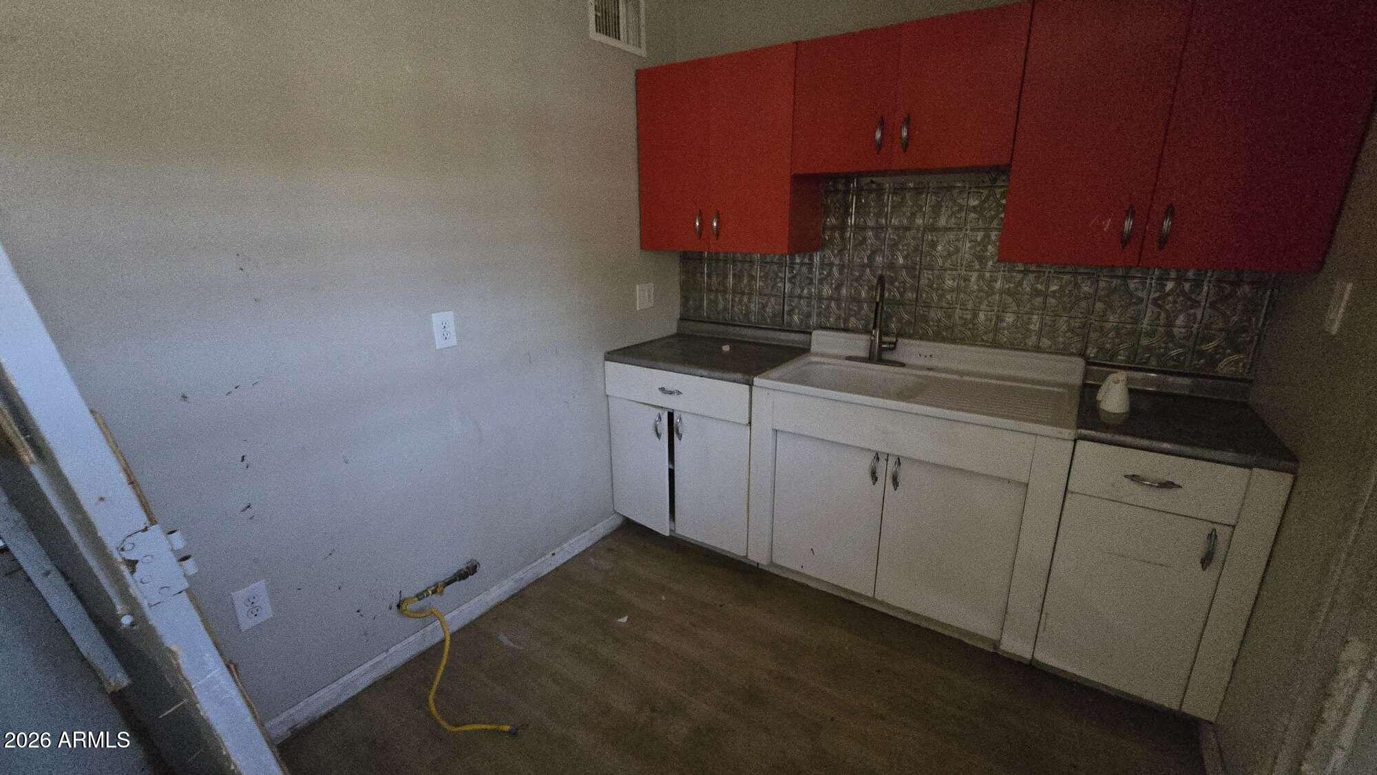 834 West Osborn Road Phoenix, AZ 85013 - Photo 29 of 45 a kitchen with a sink and cabinets