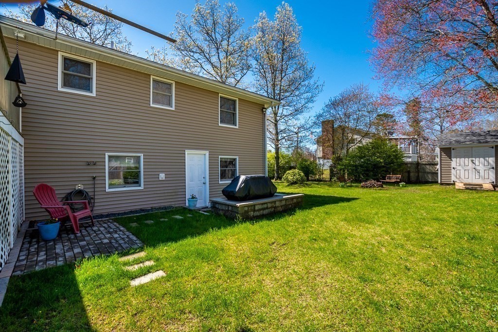 1 Roosevelt Street Wareham, MA 02571 - Photo 11 of 42 a view of a house with backyard tub and fire pit