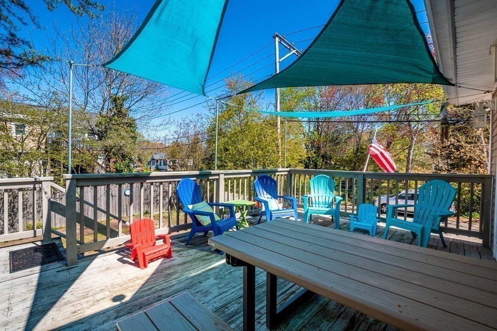 1 Roosevelt Street Wareham, MA 02571 - Photo 18 of 42 a view of deck with table and chairs under an umbrella