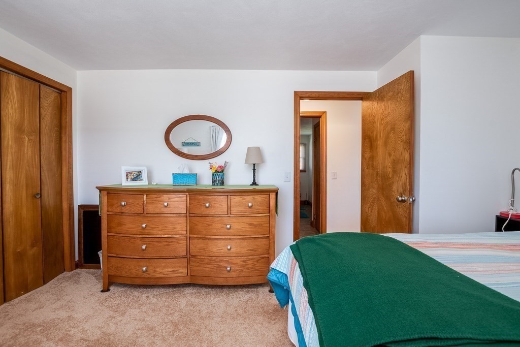1 Roosevelt Street Wareham, MA 02571 - Photo 26 of 42 a room with a bed and a dresser
