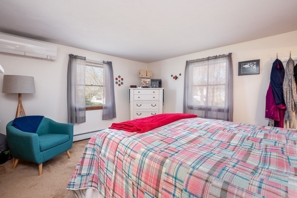 1 Roosevelt Street Wareham, MA 02571 - Photo 29 of 42 a bedroom with a bed and a couch