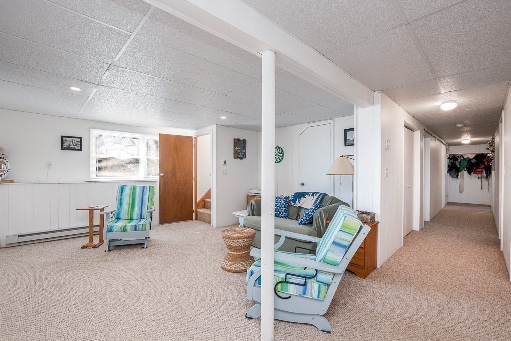1 Roosevelt Street Wareham, MA 02571 - Photo 35 of 42 a living room with furniture and a table