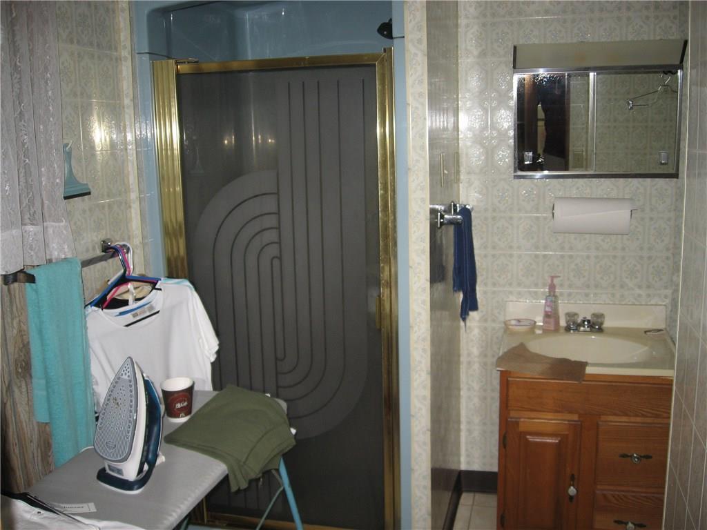 2129 Kingview Road Scottdale, PA 15683 - Photo 22 of 22 Full bathroom located on the lower level.. Shower, vanity, water closet and tile floors.