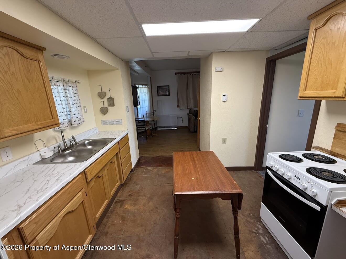 26 Le Blanc Road Craig, CO 81625 - Photo 2 of 9 a kitchen with a sink stove and cabinets