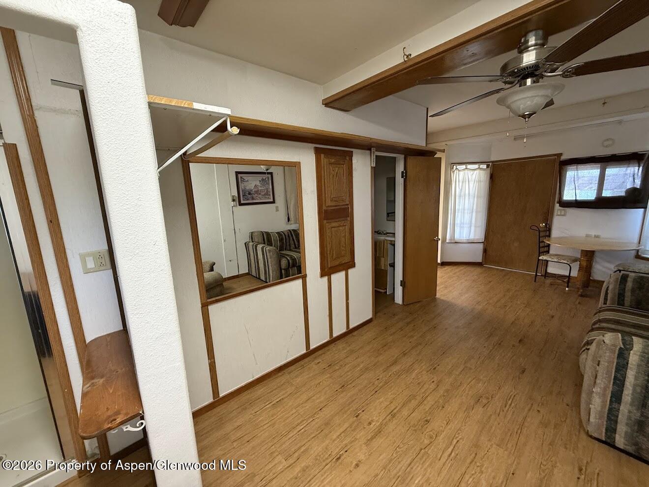 26 Le Blanc Road Craig, CO 81625 - Photo 5 of 9 a view of a hallway with wooden floor and furniture