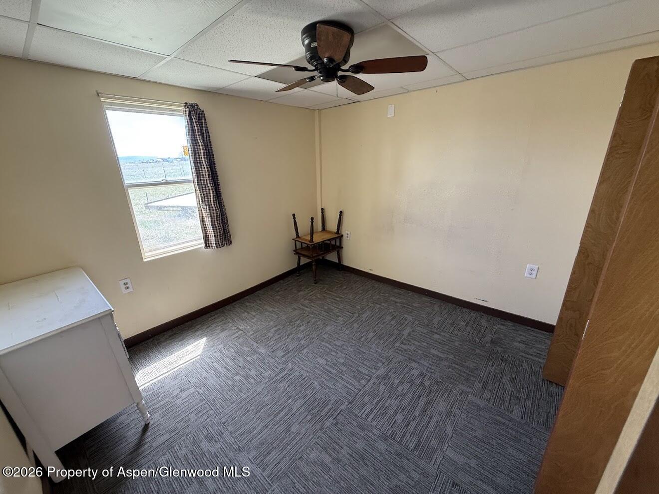 26 Le Blanc Road Craig, CO 81625 - Photo 7 of 9 a view of a livingroom with a window and a ceiling fan