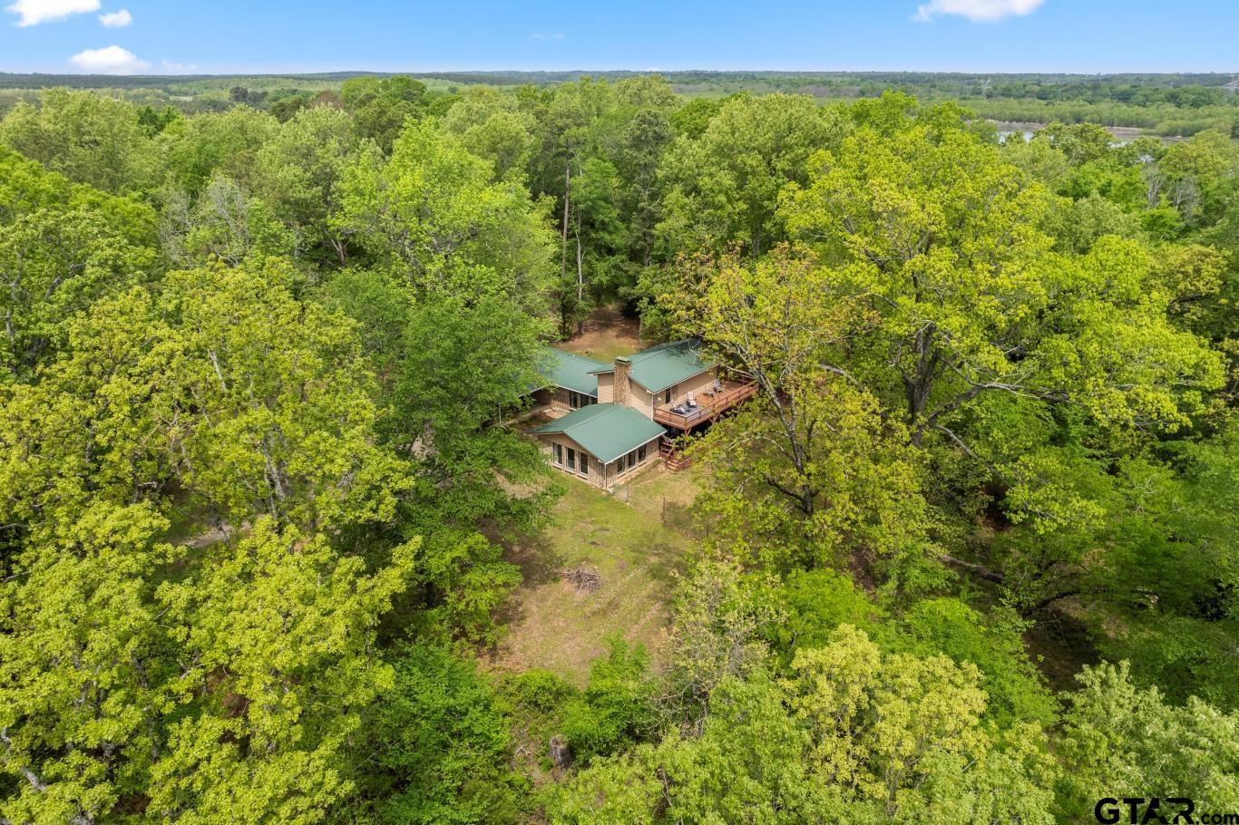 1614 County Road 2600 Mount Pleasant, TX 75455 - Photo 15 of 27 a view of outdoor space and covered with green space