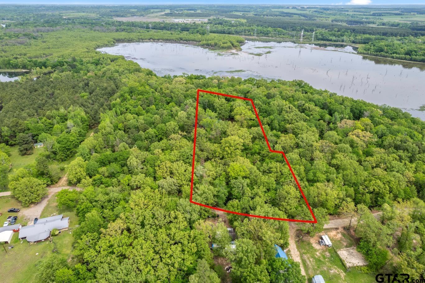 1614 County Road 2600 Mount Pleasant, TX 75455 - Photo 20 of 27 an aerial view of a houses with a yard