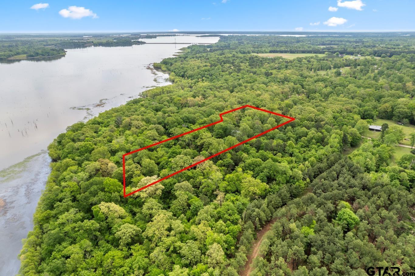 1614 County Road 2600 Mount Pleasant, TX 75455 - Photo 21 of 27 a view of an outdoor space and a lake view