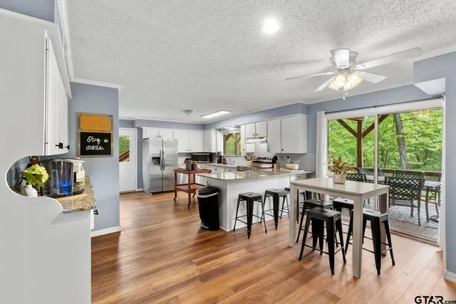 a view of a dining room with furniture window and outside view