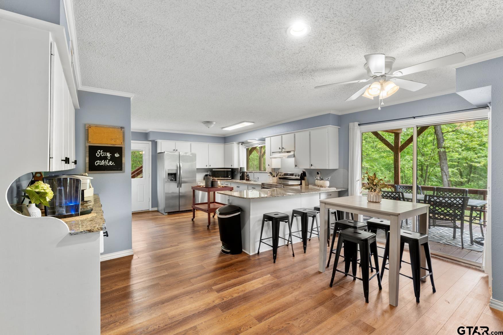 1614 County Road 2600 Mount Pleasant, TX 75455 - Photo 24 of 27 a view of a dining room with furniture window and outside view