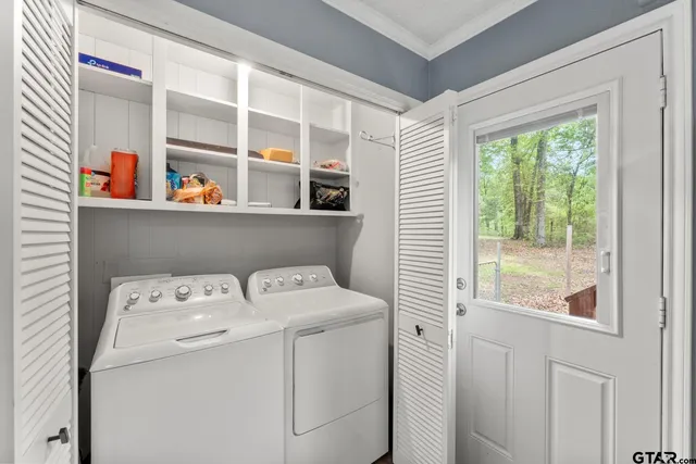 a utility room with dryer and washer