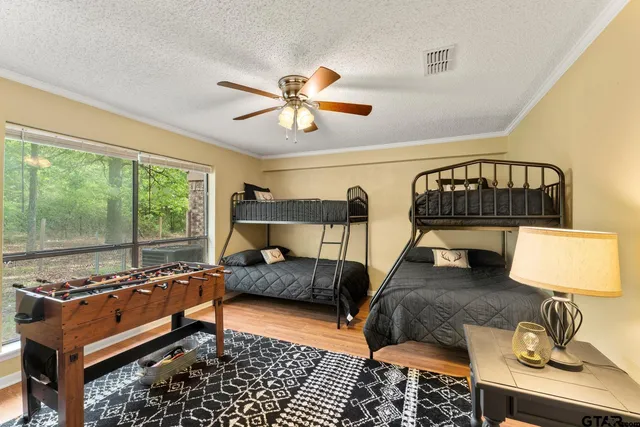 a bedroom with furniture and a window