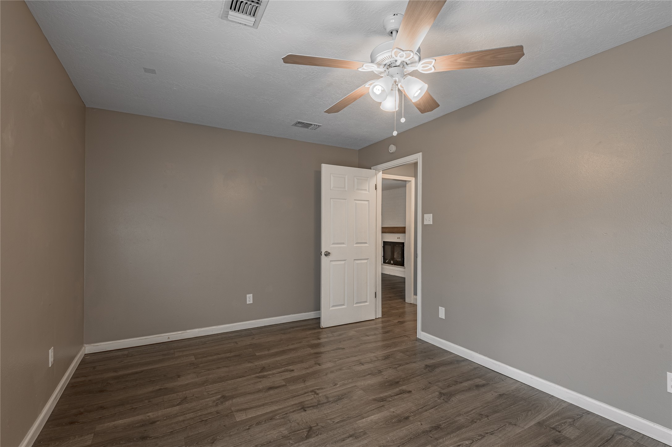1022 Landing Way Trinity, TX 75862 - Photo 15 of 30 a view of an empty room with wooden floor