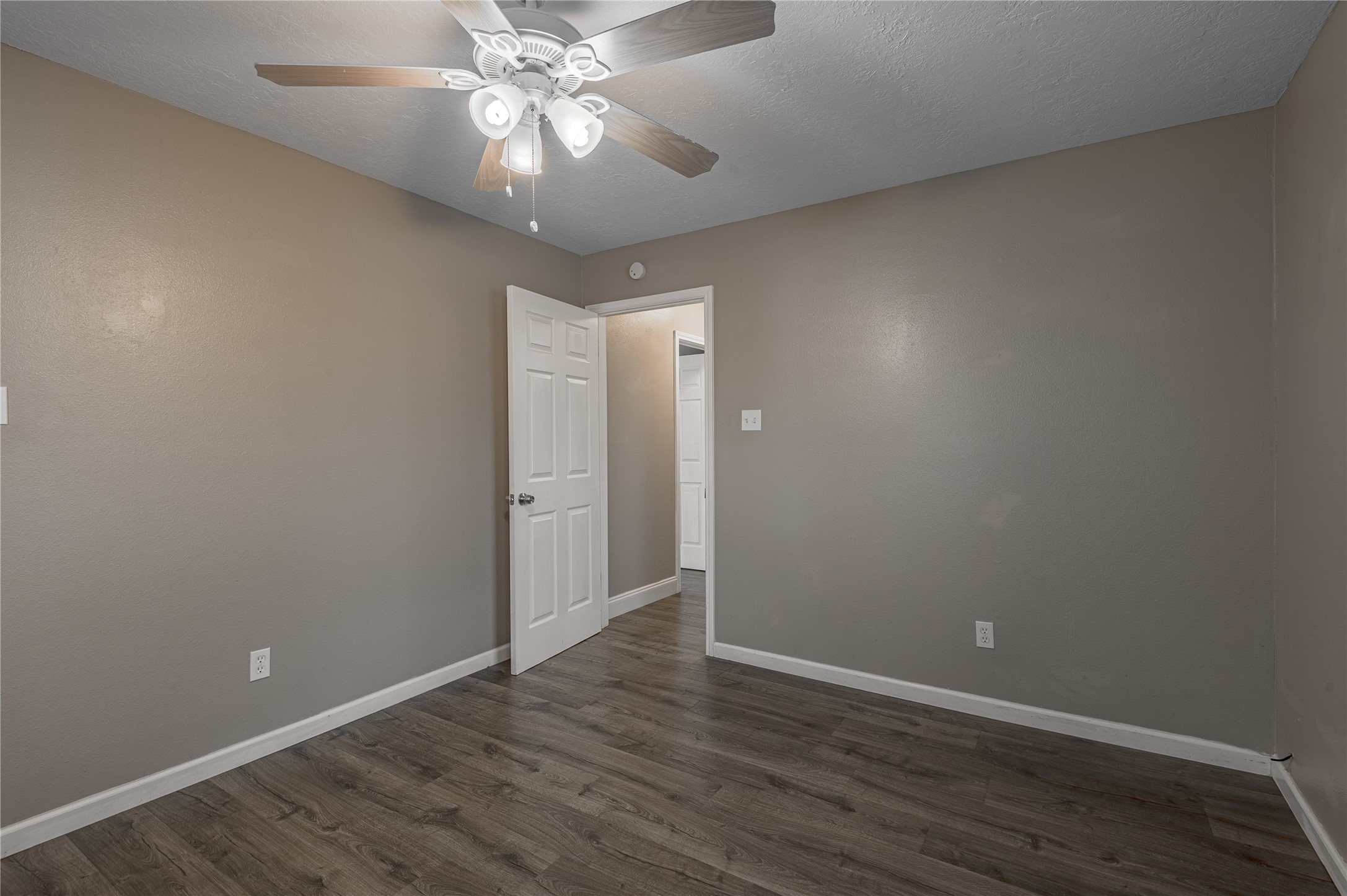 1022 Landing Way Trinity, TX 75862 - Photo 18 of 30 a view of an empty room with wooden floor