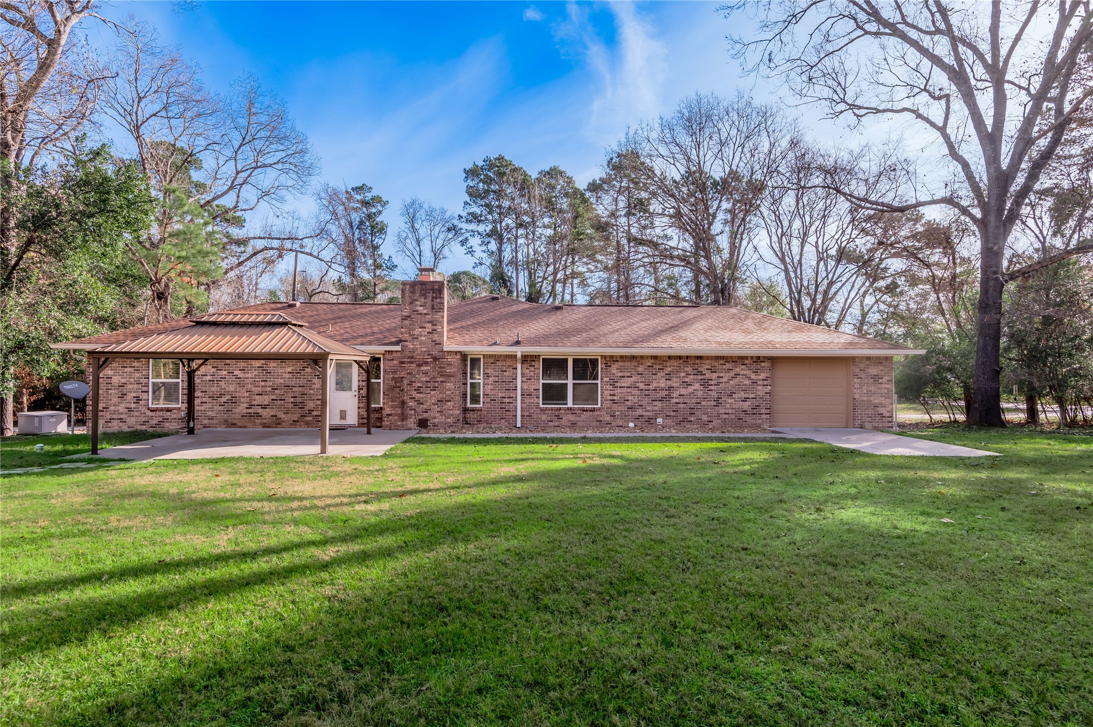 1022 Landing Way Trinity, TX 75862 - Photo 26 of 30 a backyard of a house with table and chairs