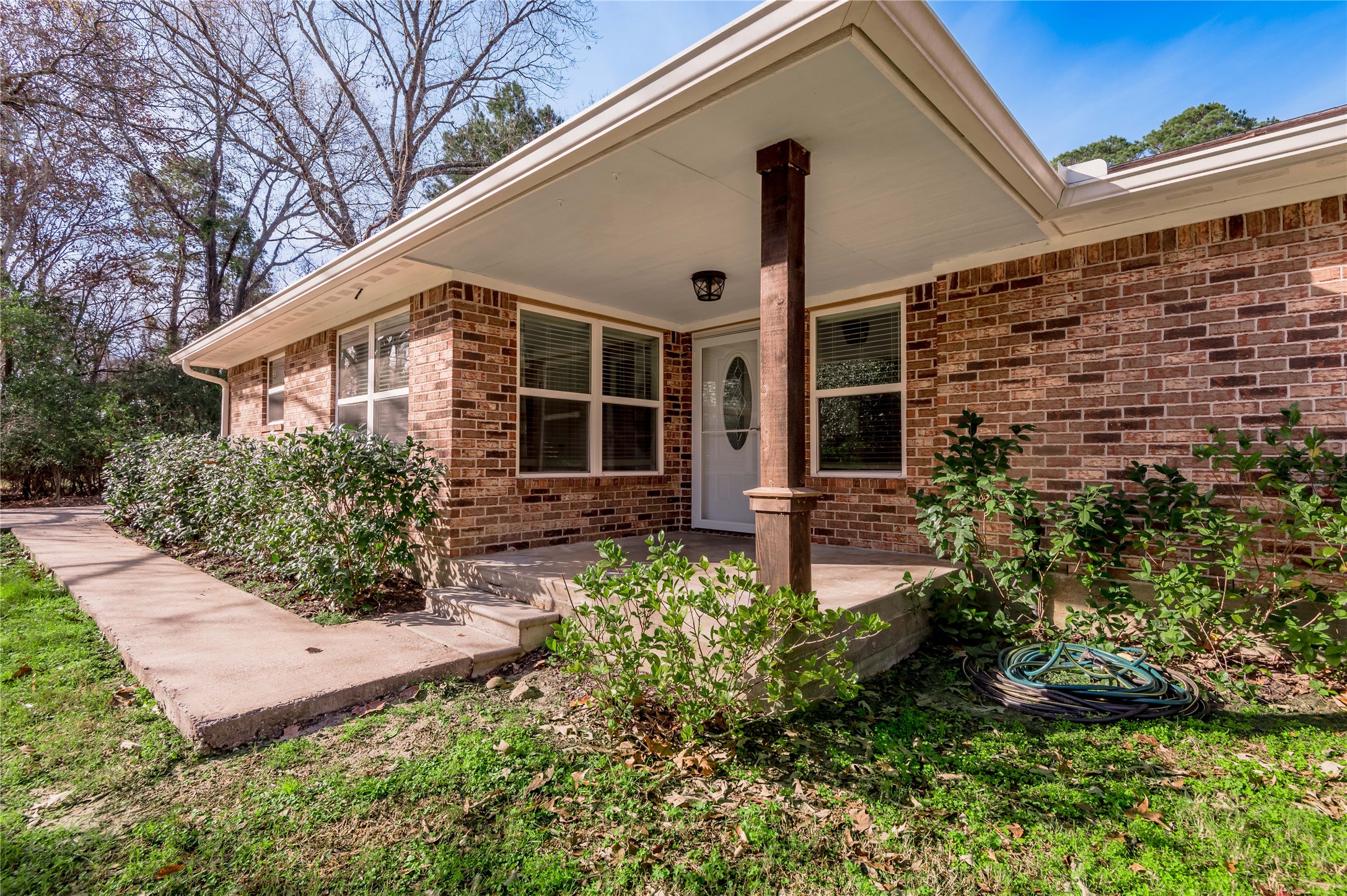 1022 Landing Way Trinity, TX 75862 - Photo 3 of 30 a front view of a house with garden