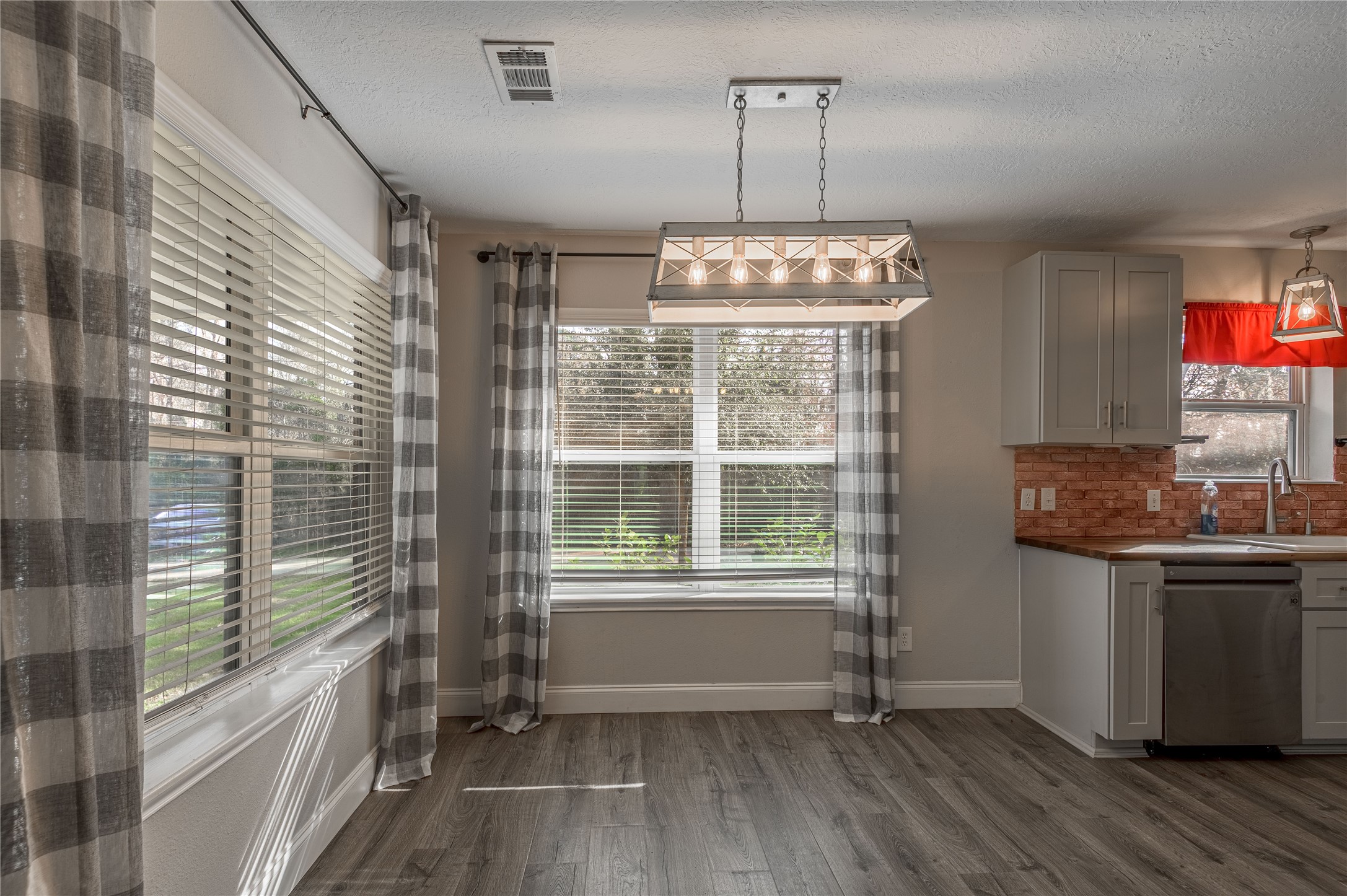1022 Landing Way Trinity, TX 75862 - Photo 6 of 30 a kitchen with stainless steel appliances granite countertop a stove and a wooden floors