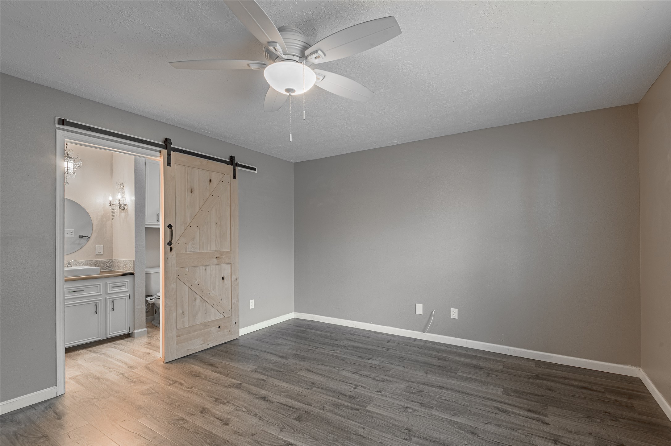 1022 Landing Way Trinity, TX 75862 - Photo 10 of 30 wooden floor in an empty room with a window