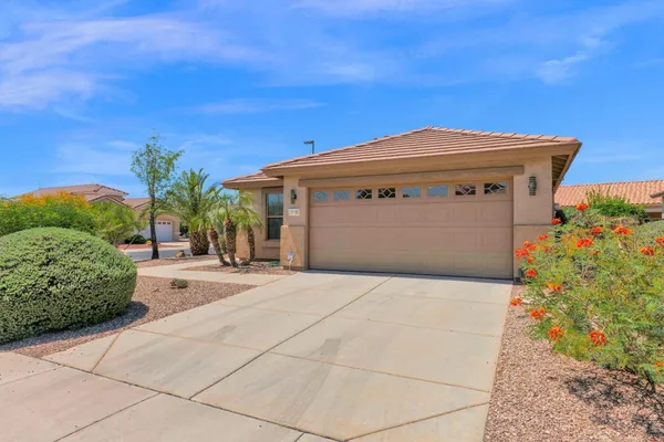 a front view of a house with a garage