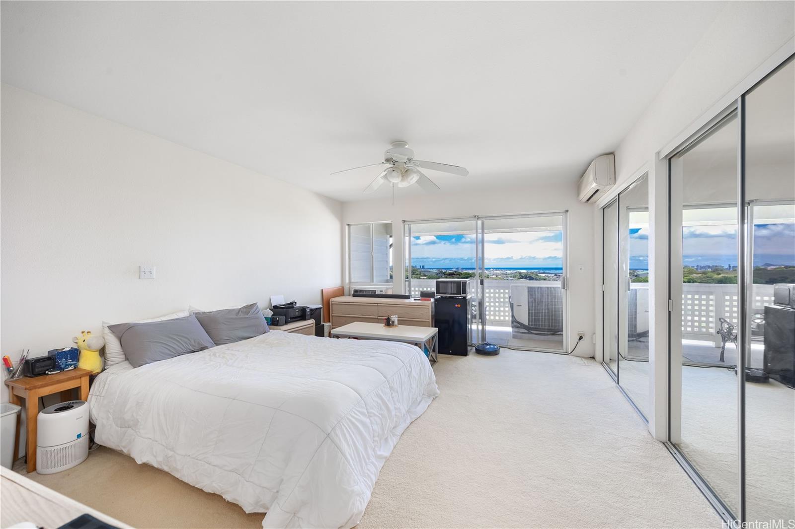 1305E Moanalualani Place, Unit 25C Honolulu, HI 96819 - Photo 11 of 21 a bed room with two bed and a large window
