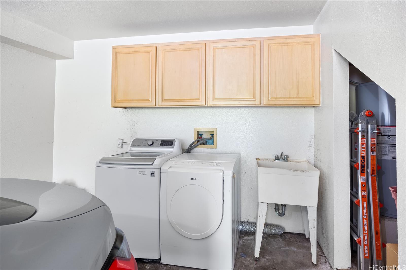 1305E Moanalualani Place, Unit 25C Honolulu, HI 96819 - Photo 18 of 21 a utility room with dryer and washer