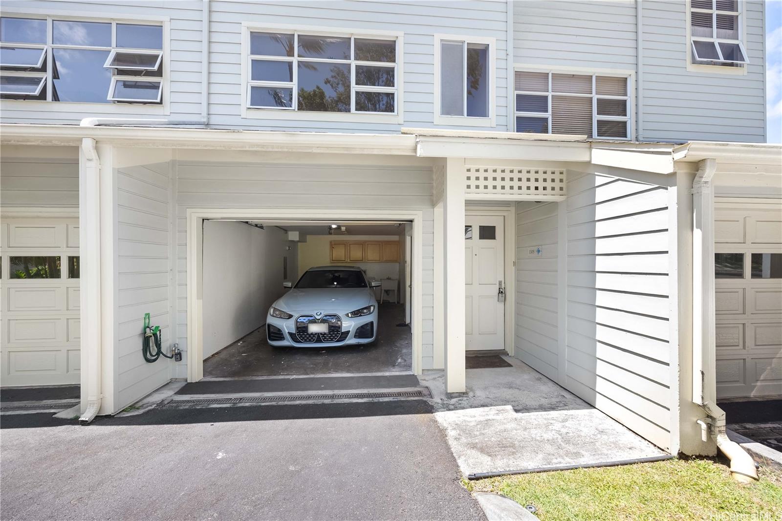 1305E Moanalualani Place, Unit 25C Honolulu, HI 96819 - Photo 19 of 21 a car parked in front of a building