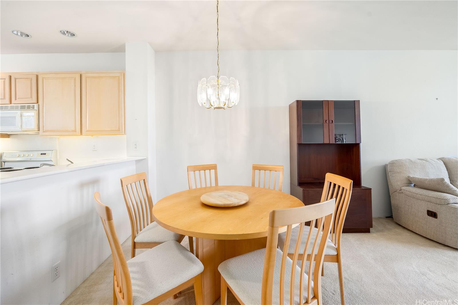 1305E Moanalualani Place, Unit 25C Honolulu, HI 96819 - Photo 5 of 21 a dining room with furniture and window