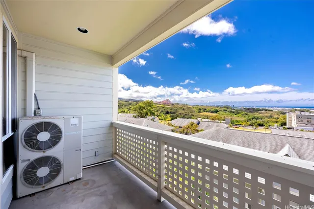a view of balcony with wooden floor