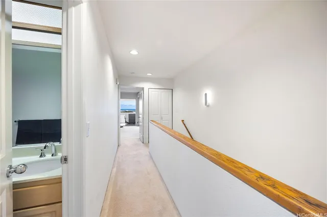 a view of a hallway with a living room