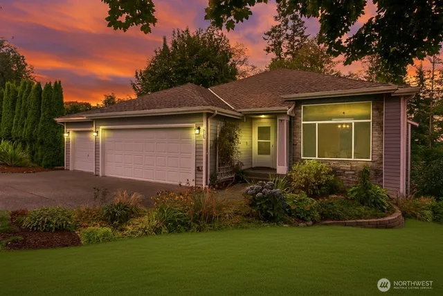 a view of a house with garden and yard
