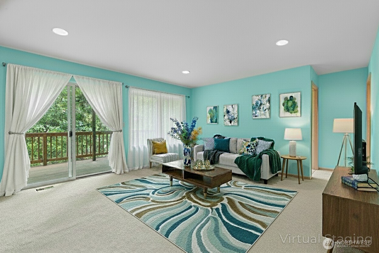 605 40th Place Everett, WA 98201 - Photo 19 of 39 a living room with furniture and a floor to ceiling window