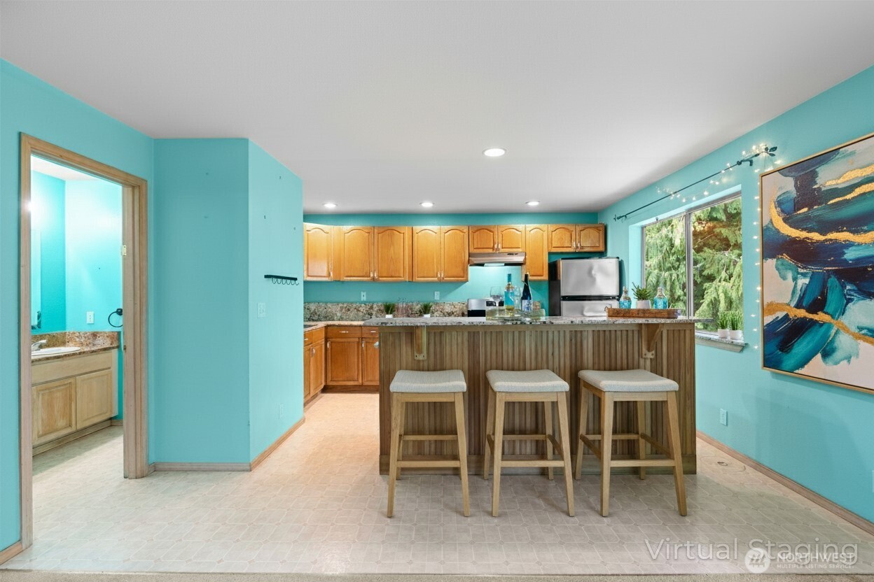 605 40th Place Everett, WA 98201 - Photo 22 of 39 a dining room with furniture and a floor to ceiling window