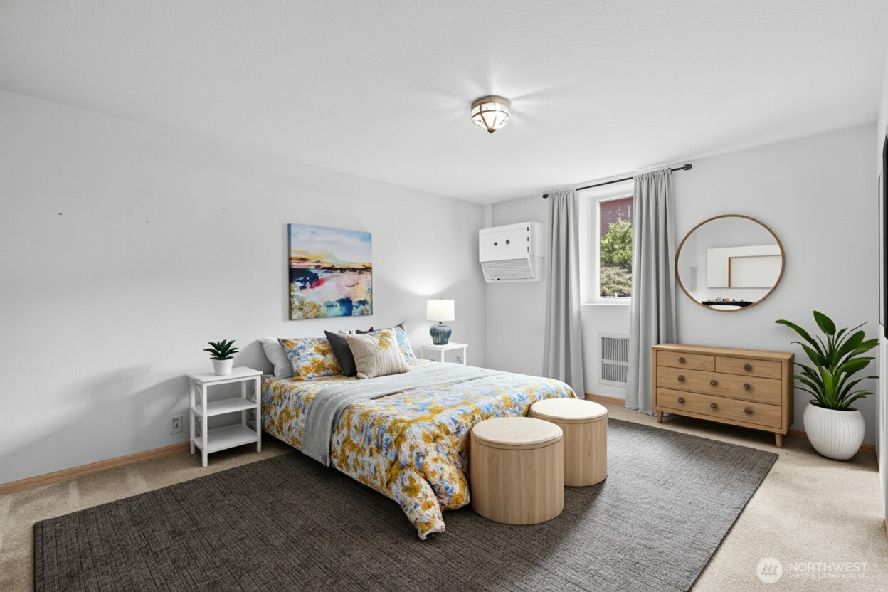 605 40th Place Everett, WA 98201 - Photo 25 of 39 a bedroom with a large bed and a chandelier